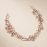 A delicate necklace with a floral design and sparkling rhinestones.