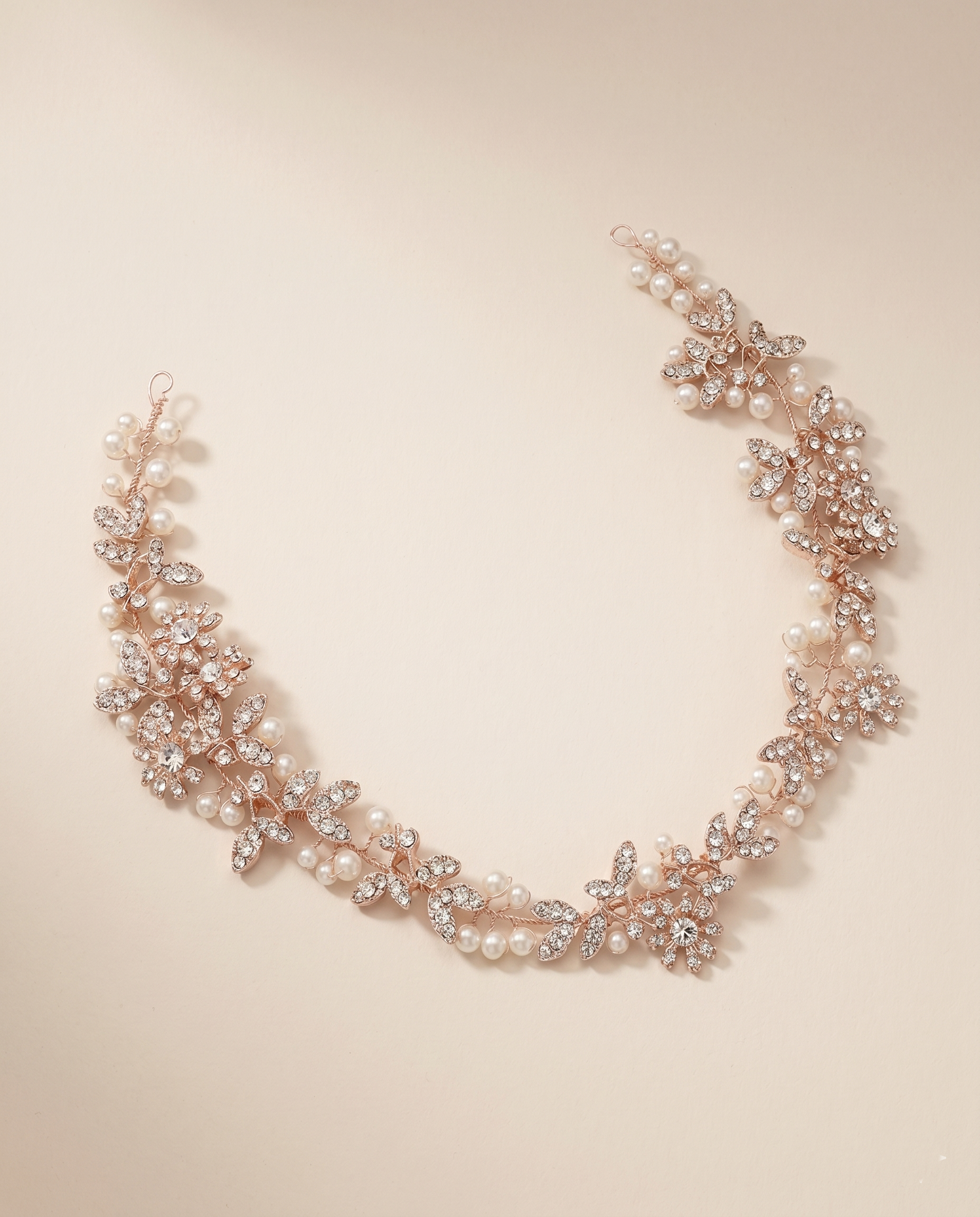 A delicate necklace with a floral design and sparkling rhinestones.