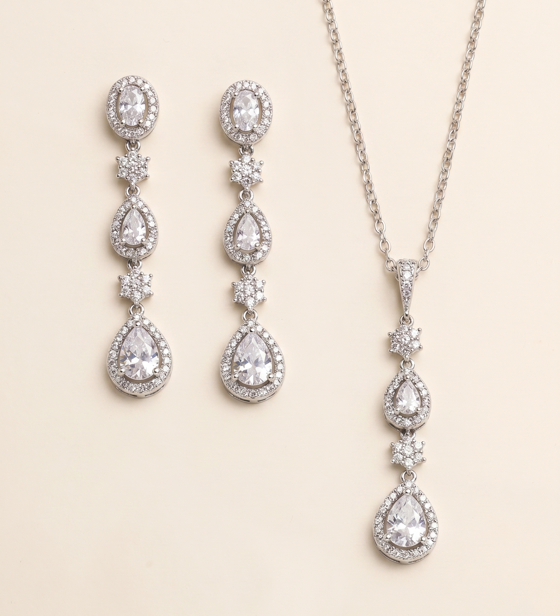 a necklace and earrings set with sparkling crystal elements.