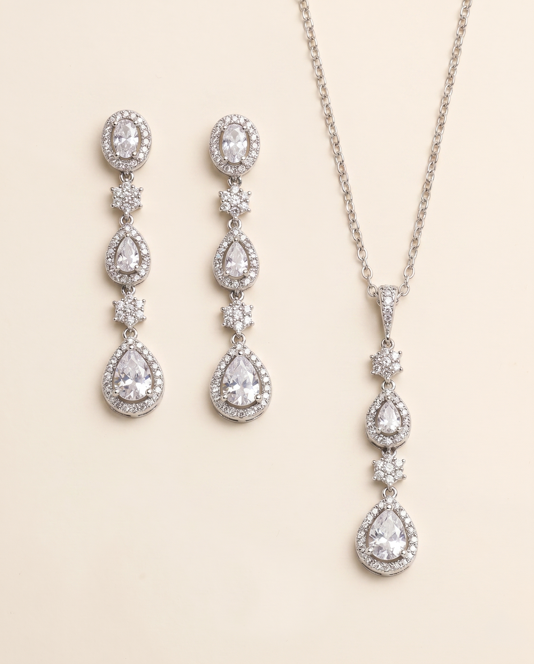 a necklace and earrings set with sparkling crystal elements.
