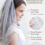 The image is an advertisement for a bridal veil, highlighting its features such as the hand-beaded pearl edge, premium soft tule, and hand-beaded tule. The ad emphasizes that the veil is designed to match the bridal-level quality and is not stiff or scratchy.