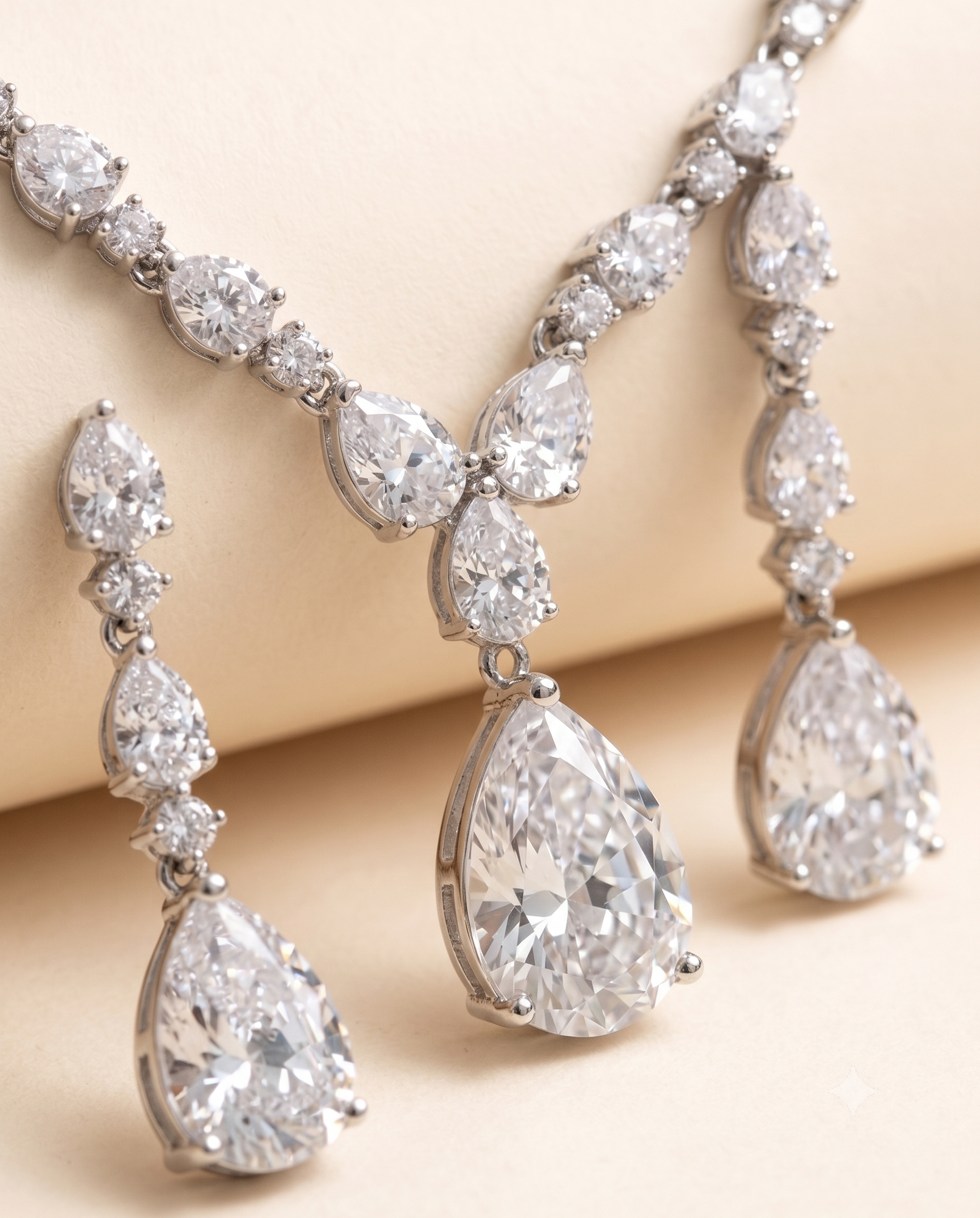 A close-up image of a necklace and earrings featuring a collection of large, sparkling diamonds.