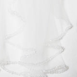 a delicate white veil adorned with small, clear crystals.