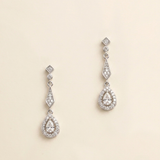 A pair of elegant earrings with a diamond-encrusted design, featuring a central pendant surrounded by smaller diamonds.