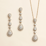 a set of elegant jewelry pieces, including earrings and a necklace, both adorned with numerous sparkling diamonds.