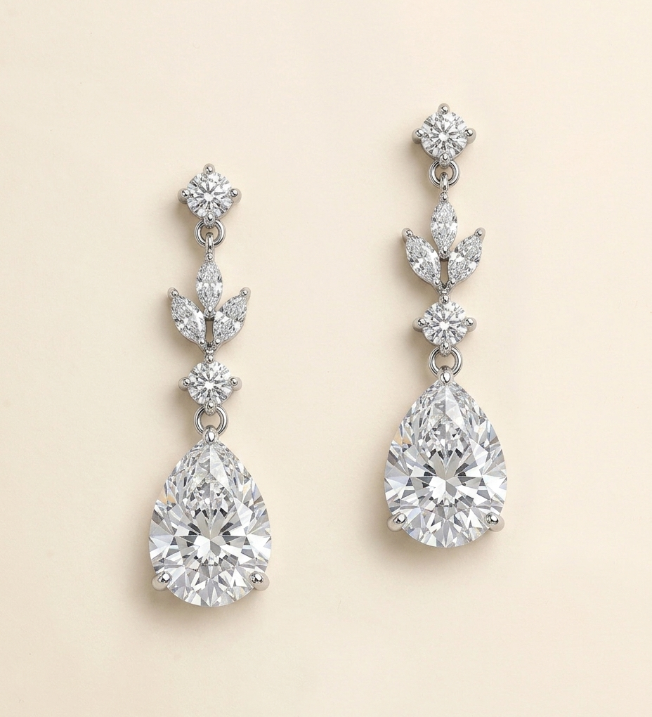 A pair of elegant diamond earrings with multiple large, clear gemstones set in a delicate, dangling design.