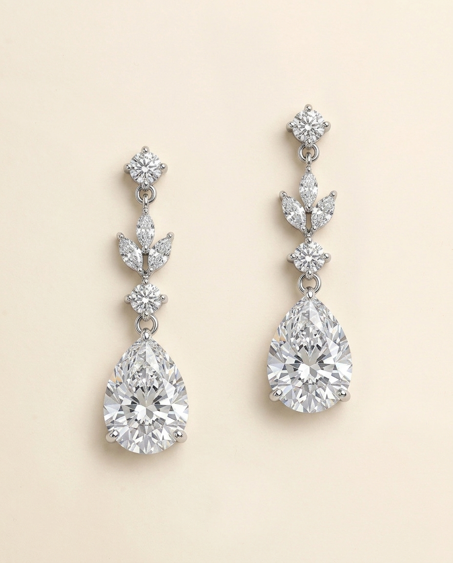 A pair of elegant diamond earrings with multiple large, clear gemstones set in a delicate, dangling design.