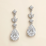A pair of elegant diamond earrings with multiple large, clear gemstones set in a delicate, dangling design.