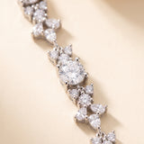 A close-up view of a delicate necklace with numerous sparkling diamonds arranged in a delicate pattern.