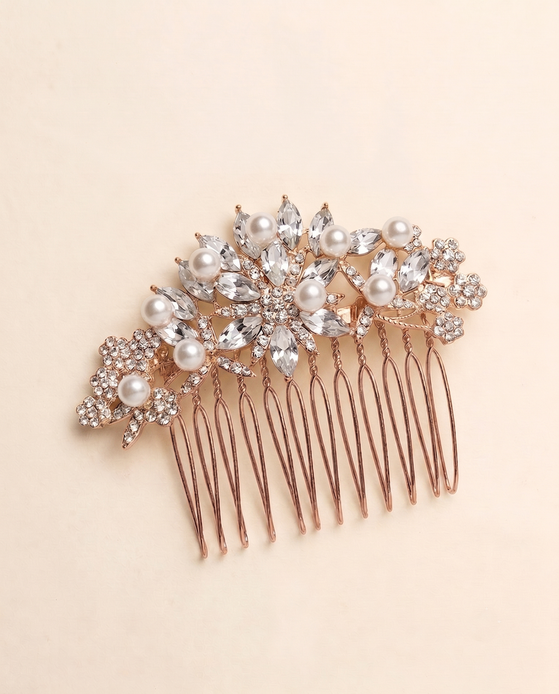 A decorative hair accessory with a floral design and numerous sparkling crystal elements.