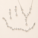 a delicate and elegant jewelry set consisting of a necklace, earrings, and a bracelet, all adorned with small, sparkling crystal elements.