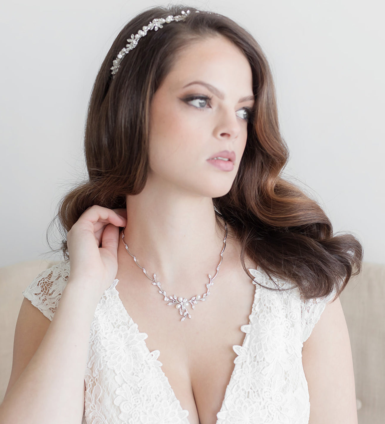 a woman in a white dress wearing a tiara