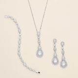 a collection of elegant jewelry pieces, including a necklace, a bracelet, and earrings, all adorned with sparkling diamonds.