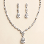 A necklace and earrings set made of sparkling diamonds.