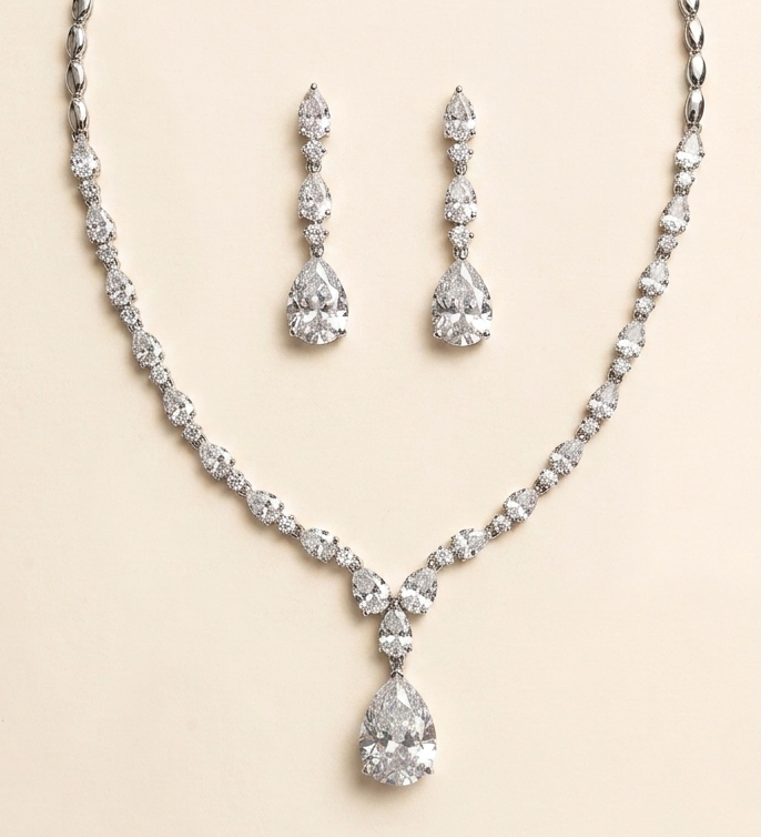 A necklace and earrings set made of sparkling diamonds.