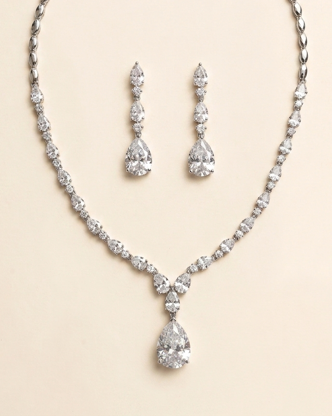 A necklace and earrings set made of sparkling diamonds.