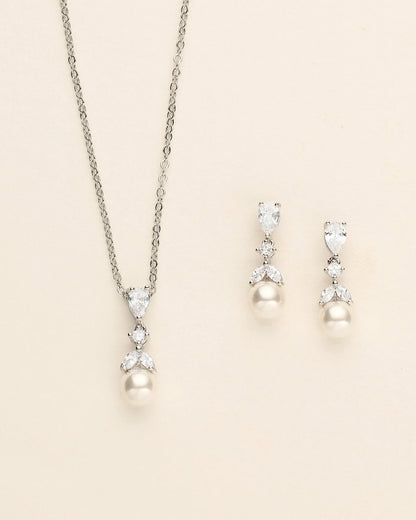 a necklace and earring set with pearls