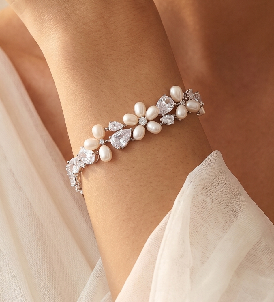 A close-up of a person's arm wearing a bracelet with pearls and diamonds.