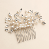A decorative hair accessory with a comb and a floral design made of pearls and crystals.