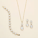 a necklace, bracelet, and earrings are shown on a white surface