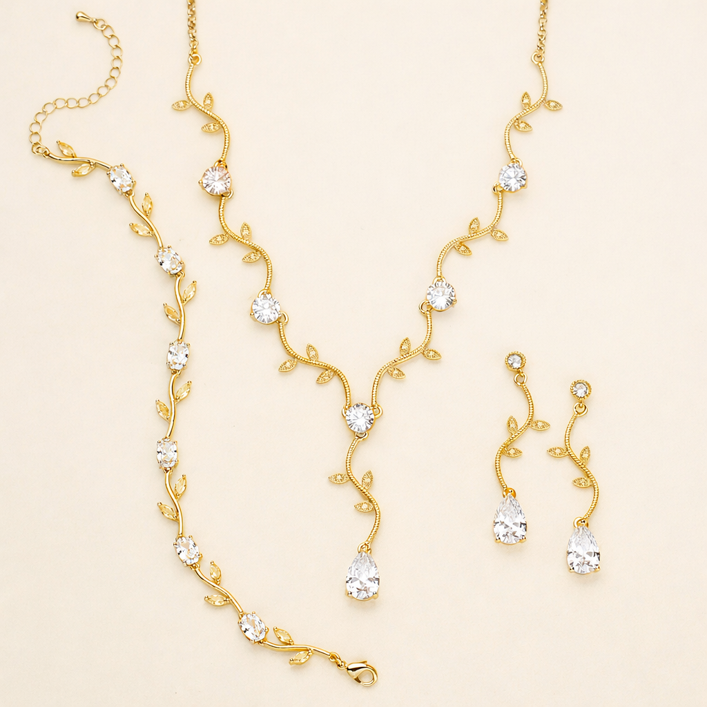 a set of gold jewelry pieces, including a necklace, earrings, and a bracelet, all adorned with small, clear gemstones.