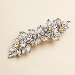 A decorative hair clip adorned with numerous sparkling crystal stones.
