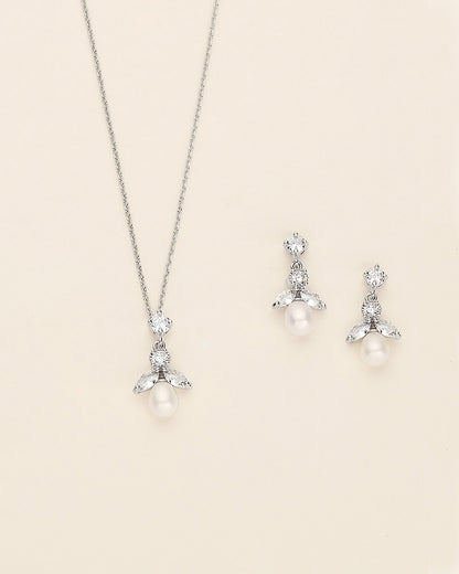 a necklace and earring set with pearls