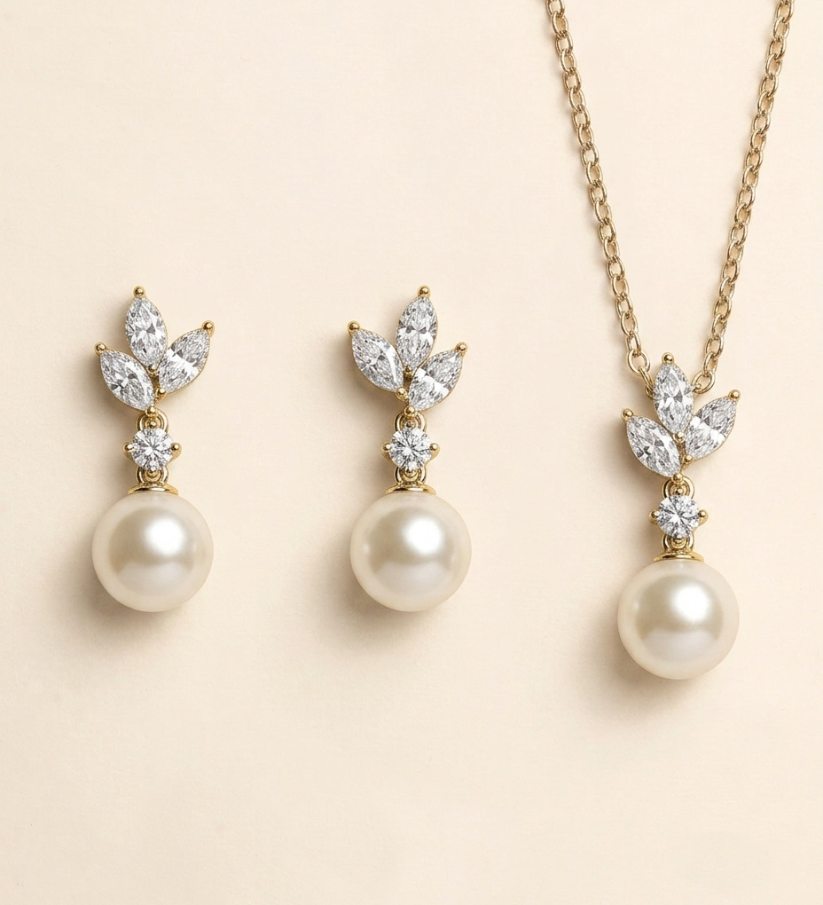 A set of three pearl earrings and a necklace with pearls and diamonds.