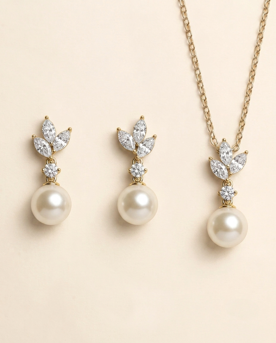 A set of three pearl earrings and a necklace with pearls and diamonds.