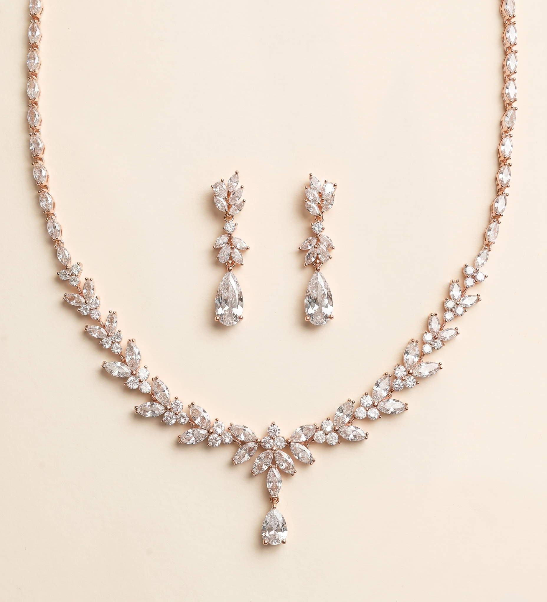 a necklace and earrings set made of sparkling diamonds.