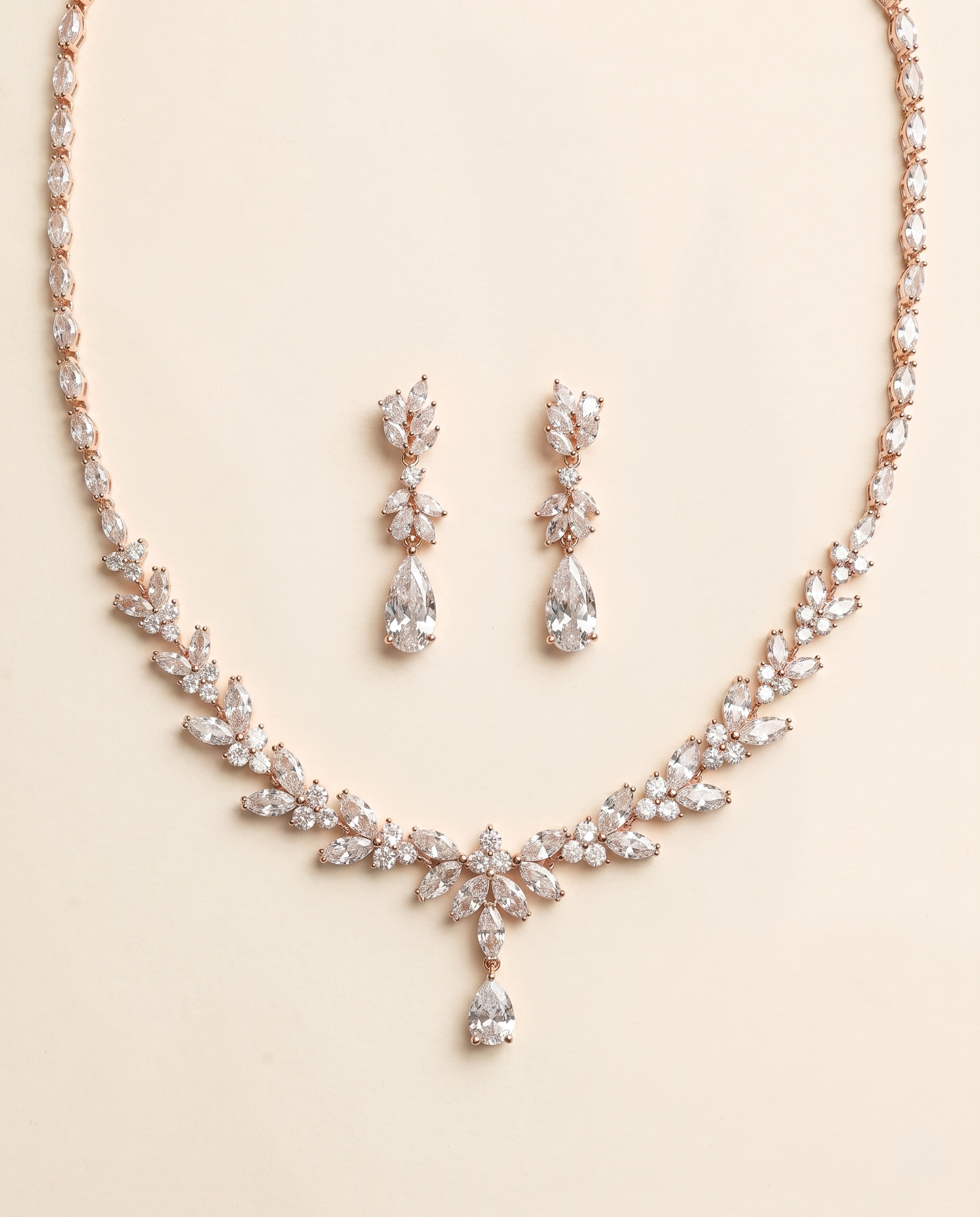 a necklace and earrings set made of sparkling diamonds.