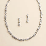 A necklace and earrings set made of sparkling diamonds.