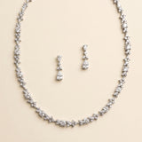 A necklace and earrings set made of sparkling diamonds.