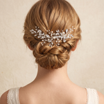 the back view of a woman's head, focusing on her hair and the decorative hair accessory she is wearing.