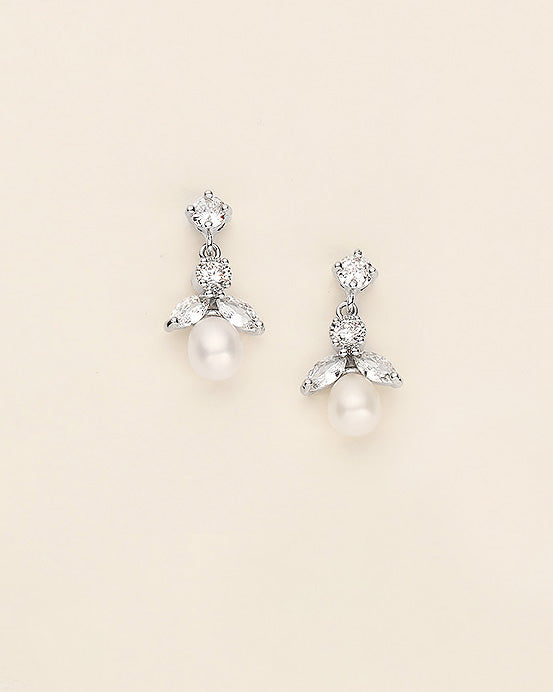 a pair of white pearl and crystal earrings