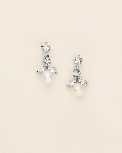 a pair of white pearl and crystal earrings