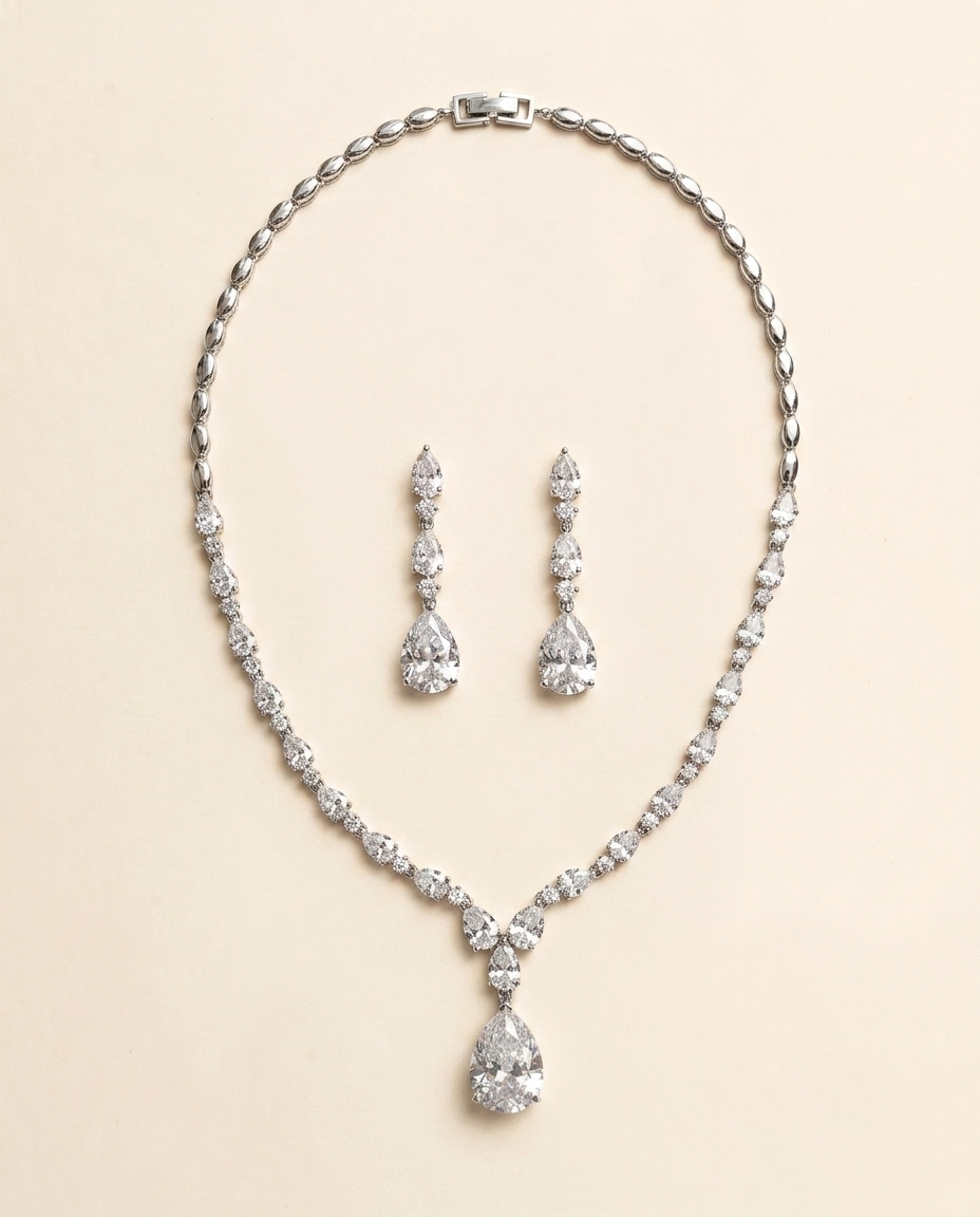 a necklace and earrings set made of sparkling diamonds.