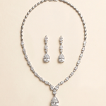 a necklace and earrings set made of sparkling diamonds.