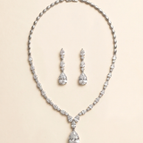 a necklace and earrings set made of sparkling diamonds.
