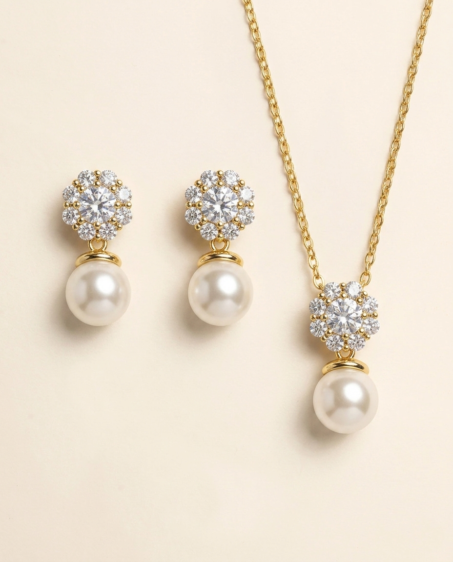 A set of elegant pearl and diamond jewelry, including earrings and a necklace, displayed against a light background.