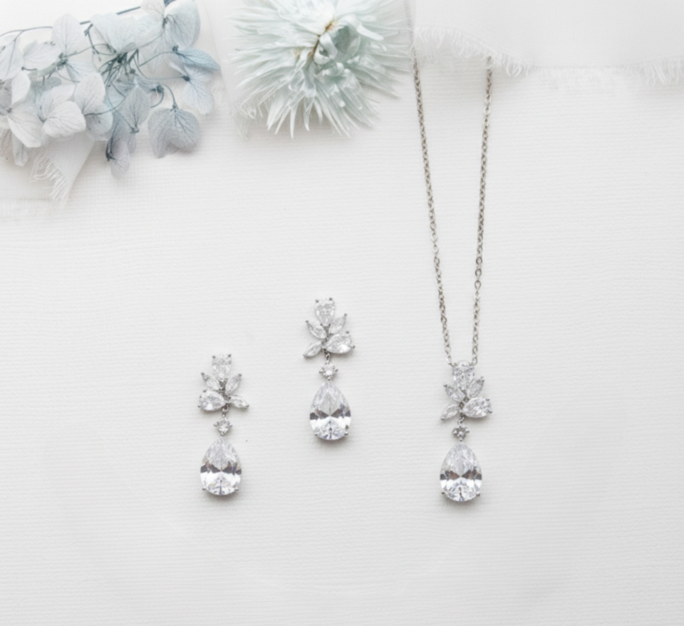 a collection of elegant jewelry pieces, including a necklace, earrings, and a bracelet, all adorned with large, sparkling diamonds.