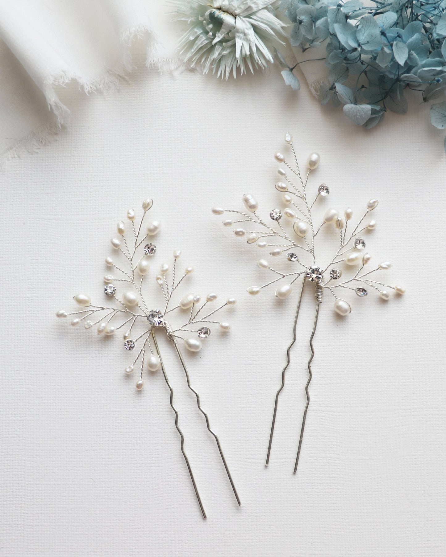 a couple of pins sitting on top of a table