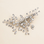 A decorative hair clip adorned with numerous sparkling crystal stones.