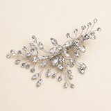 A decorative hair clip adorned with numerous sparkling crystal stones.