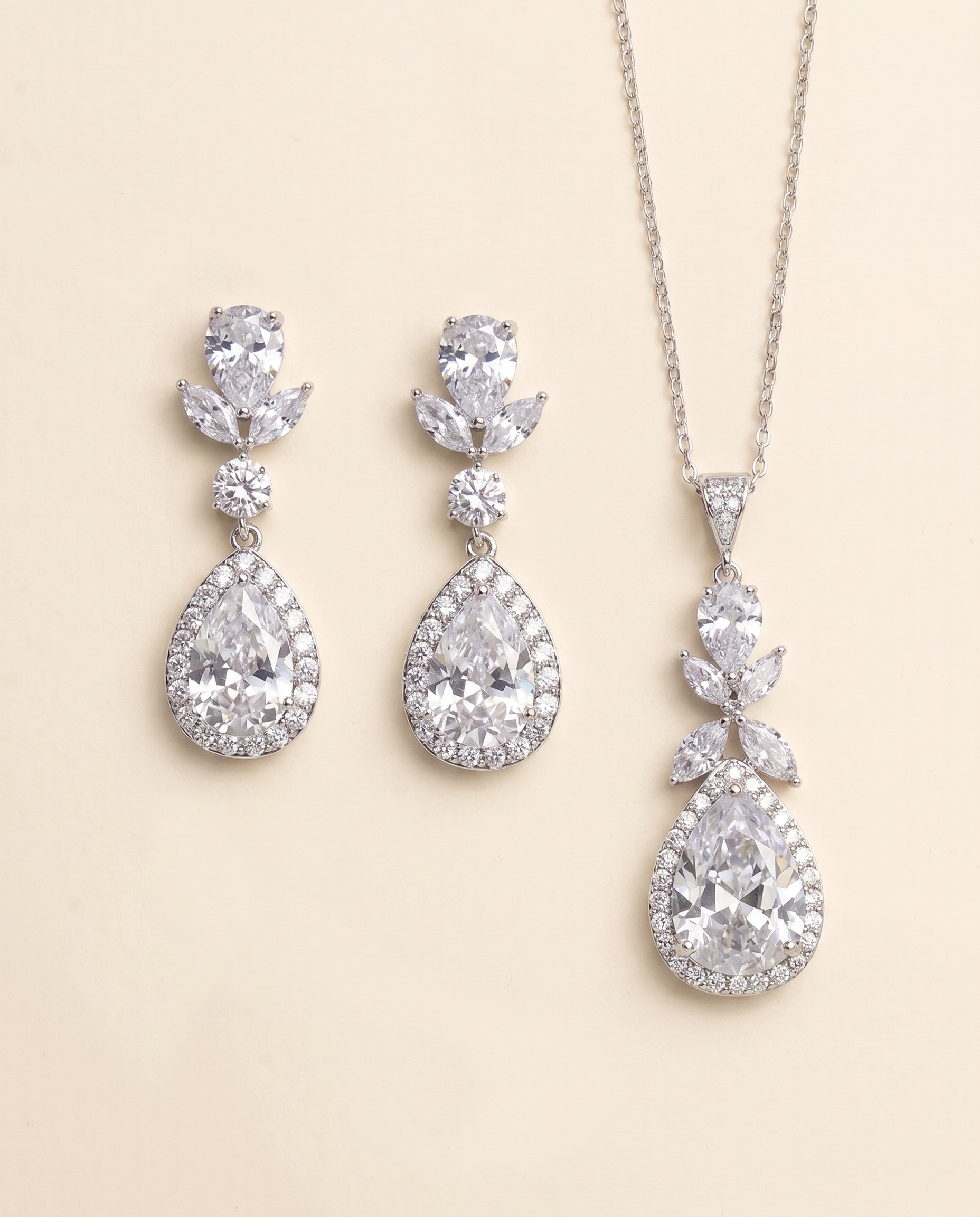 A necklace and earrings set made of sparkling diamonds.