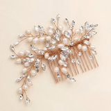 A decorative hair accessory with a combination of pearls, crystals, and metallic wires.
