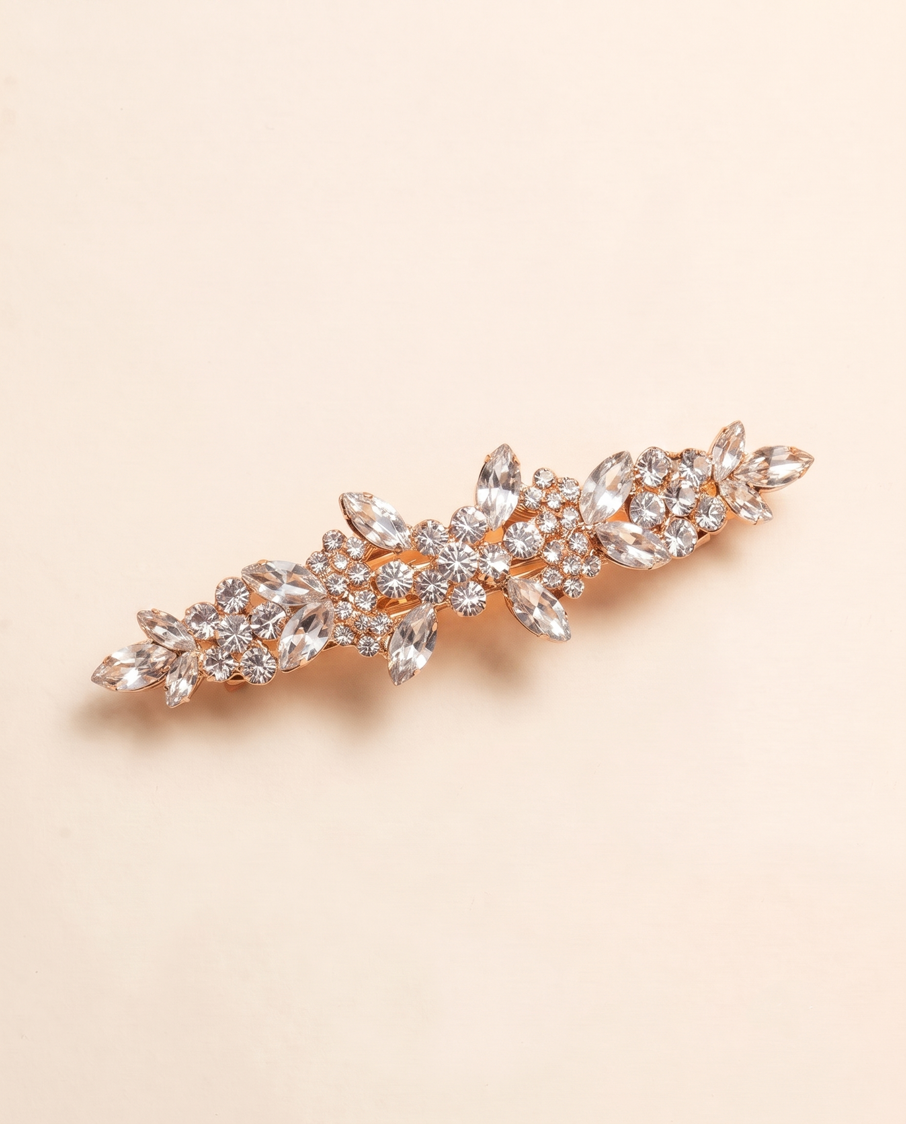 A decorative hair clip adorned with numerous sparkling rhinestones or crystals, creating a visually striking and elegant accessory.