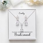 A necklace and earrings set with a personalized message, placed on a white background.