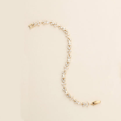 a pearl and gold necklace with a watch on it