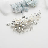 a close up of a hair comb with flowers in the background